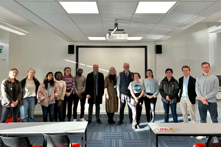 Christos Stylianides with staff and students from the Graduate School for Interdisciplinary Studies at his public lecture
